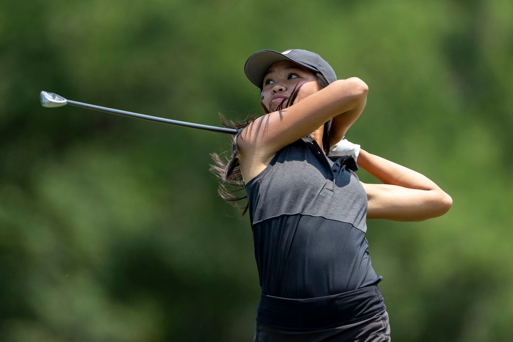Mansfield’s Madison Le hits from the 8th tee box during the 6A girls state golf tournament...