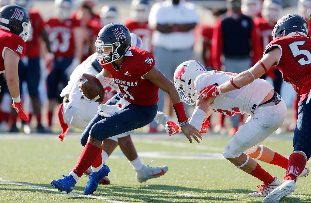 Plano John Paul II's Grayson James breaks out of the pocket as Parish Episcopal defense looks to make a play during the second half of play at the TAPPS Division I State Championship game at Waco Midway's Panther Stadium in Hewitt, Texas on Friday, December 6, 2019. Parish Episcopal defeated Plano John Paul II 42-14 to win the championship game. (Vernon Bryant/The Dallas Morning News)
