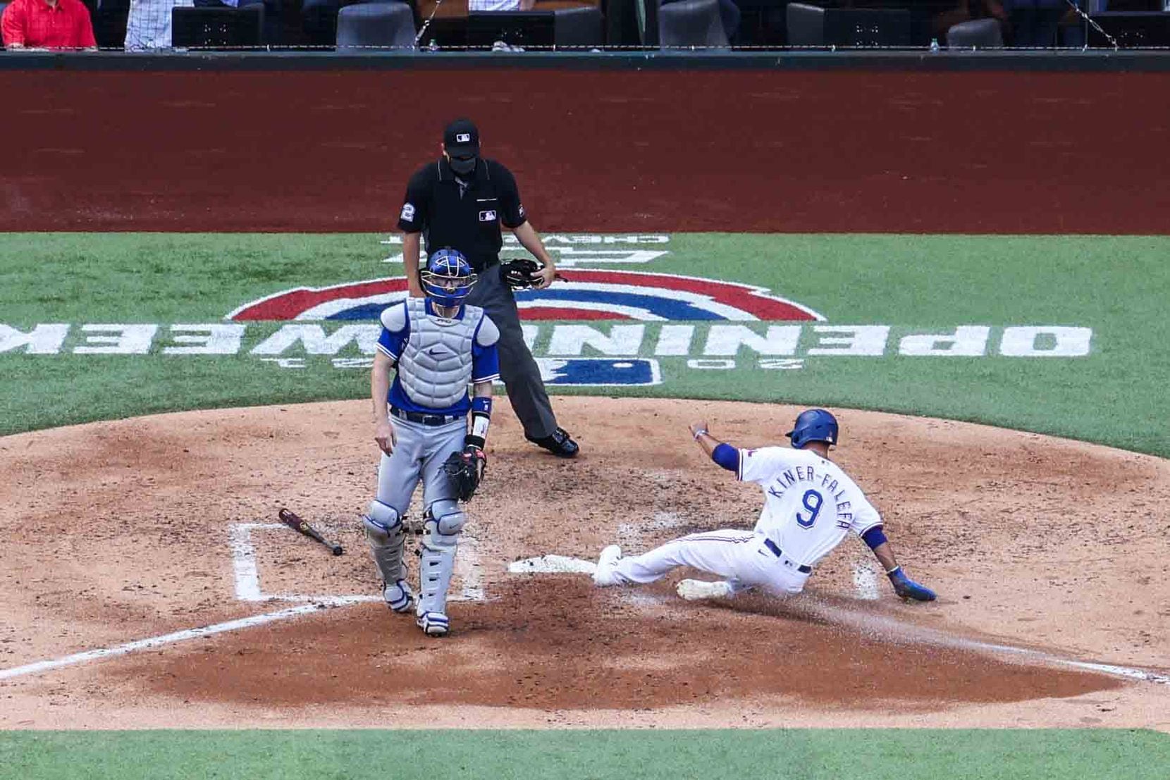 Texas Rangers' infielder Isiah Kiner-Falefa No. 9 slides to home plate to add the first run for the team during 4th inn against Toronto Blue Jays at the Globe Life Field during opening day in Arlington, Texas on Monday, April 5, 2021. (Lola Gomez/The Dallas Morning News)