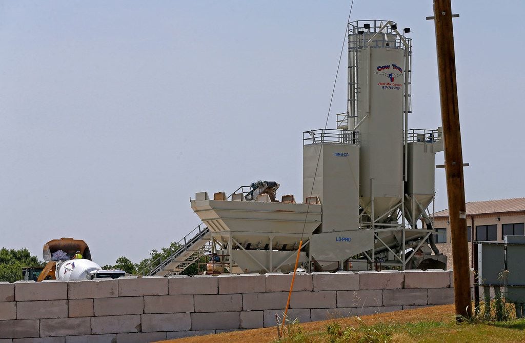 Concrete batch plant Cowtown Redi Mix is located near a mobile home community on Wednesday in McKinney.  