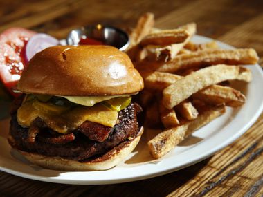 Sugarbacon's burger features a Wagyu beef patty dressed with aged cheddar, garlic mayo, bread-and-butter-pickles and a slice of sugarbacon.