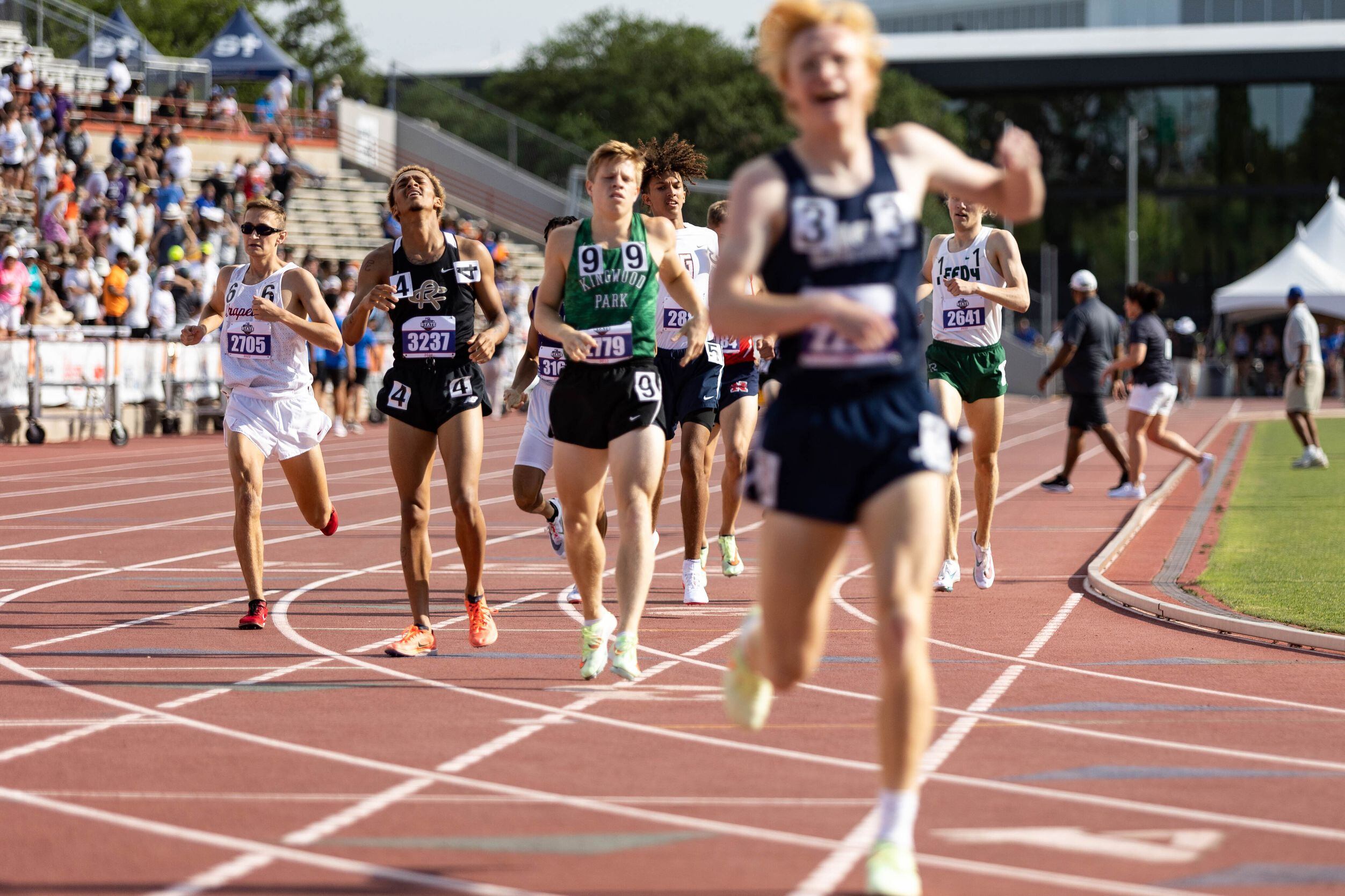 Chasetin Winston of Royse City, second from the left, reacts at the finish line of the boys’...