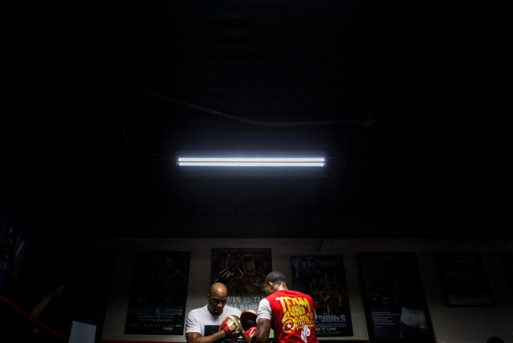 Number one ranked IBF Welterweight contender Errol Spence, Jr. works out with his trainer, Derrick James on Tuesday, April 25, 2017 at R&R Boxing Club in Dallas. The workout is in advance of his mandatory title shot against IBF Welterweight Champion Kell Brook on Saturday, May 27 in Sheffield, England. (Ashley Landis/The Dallas Morning News)