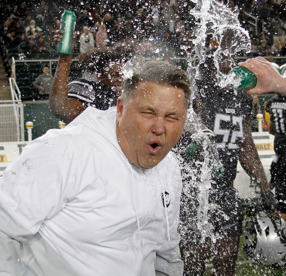 Denton Guyer head coach Rodney Webb reacts as he is doused with water during the waning seconds of their 59-14 victory over Tomball to advance to the state final. The two teams played their  Class 6a Division ll state semifinal football playoff game at Baylor's McLane Stadium in Waco on December 11, 2021. (Steve Hamm/ Special Contributor)