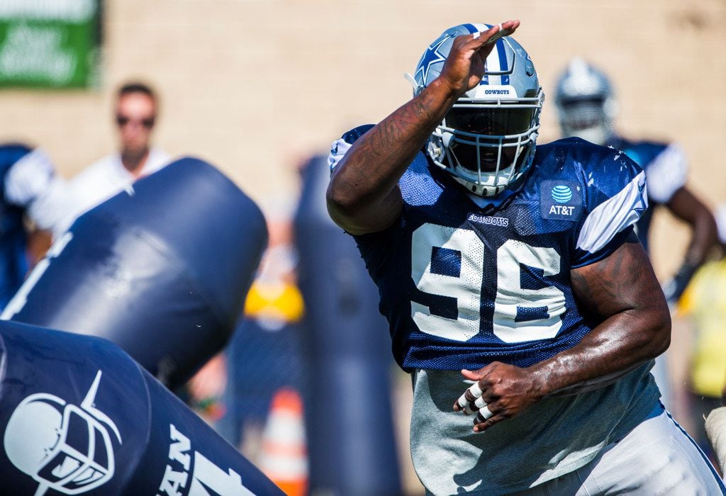 Dallas Cowboys defensive tackle Maliek Collins (96) attacks a dummy during an afternoon...