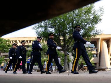 A member of the DART (Dallas Area Rapid Transit) Police Honor Guard (third from left)...