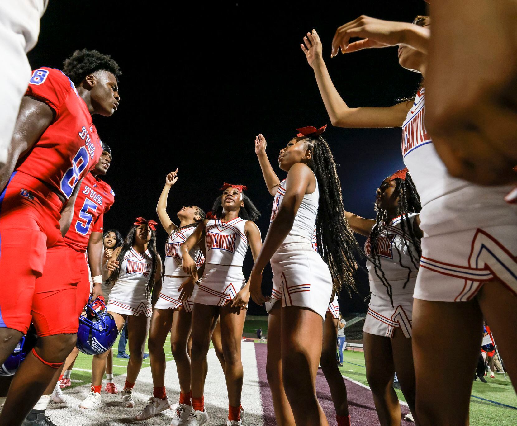 Duncanville High School Colin Simmons (8) and Malachi Medlock (5) celebrate with...