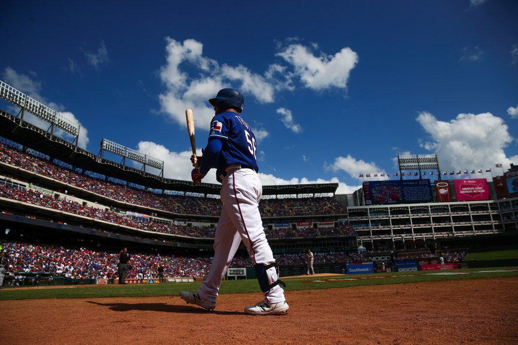 Texas Rangers catcher Jose Trevino (56) walks up to bat during a MLB game between Texas...