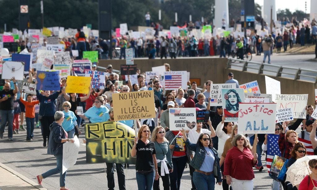Thousands showed up and marched through the city for immigrant and refugee communities in...