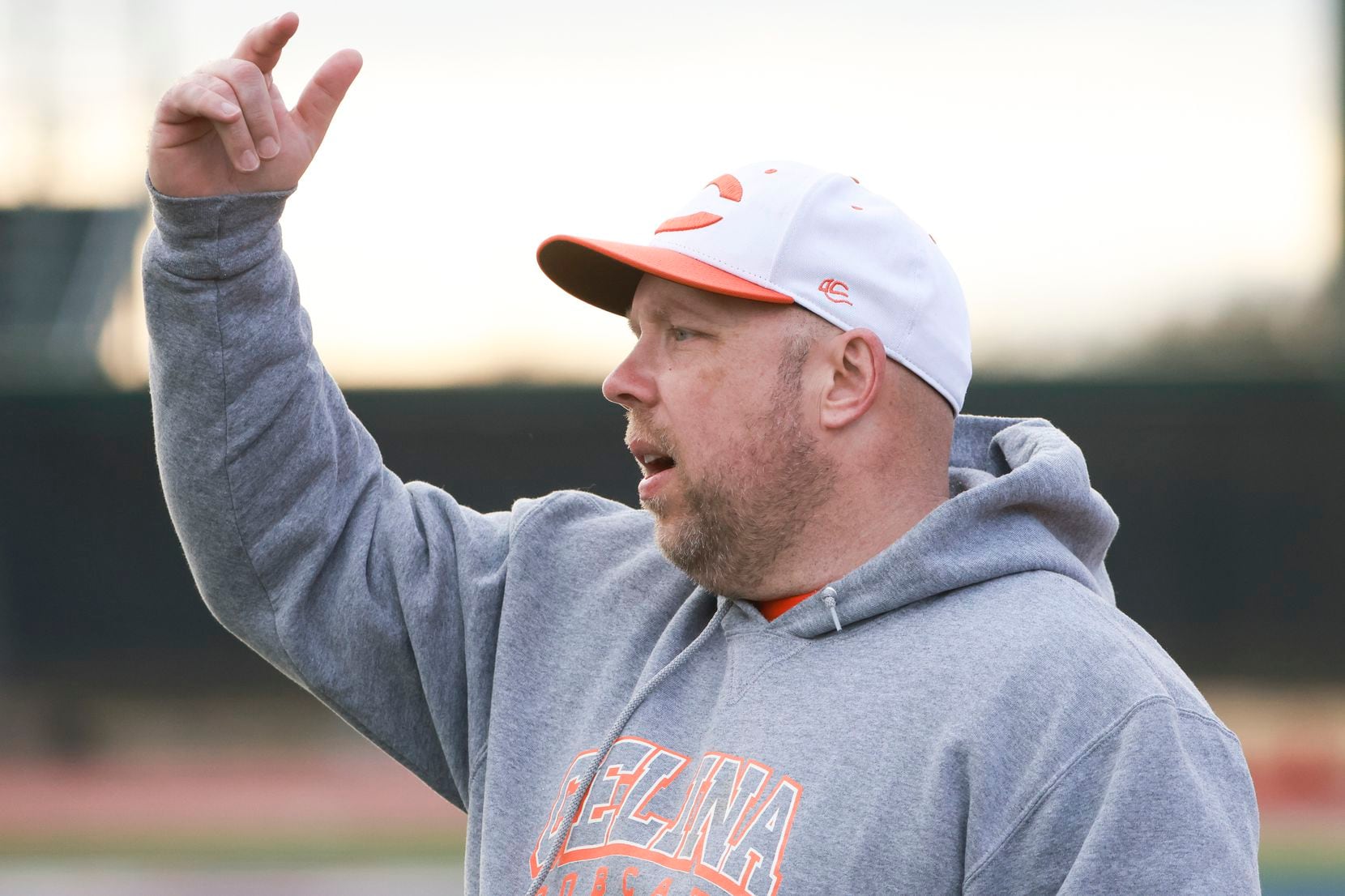Celina High School’s head coach Alexander Adams coaches from the sidelines during the game...