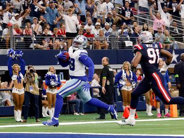 Dallas Cowboys defensive end Chauncey Golston (99) scores a two-point conversion against New...