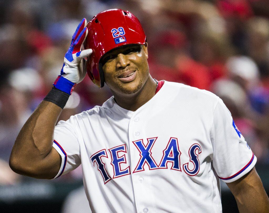 Texas Rangers third baseman Adrian Beltre (29) jokes around as he walks up to bat with his...