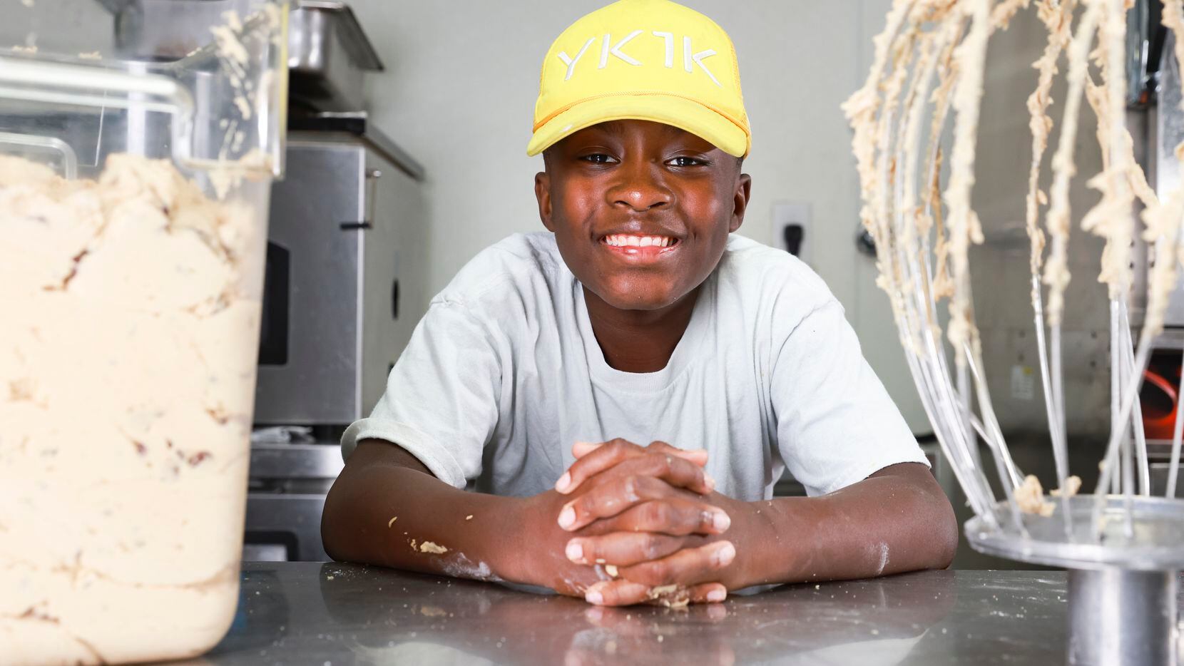 Dallas Wise, 12, after making chocolate chip cookie dough, Friday, Nov. 18, 2022, in Dallas....