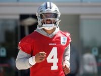 Dallas Cowboys quarterback Dak Prescott (4) enters the field for a practice session at the...