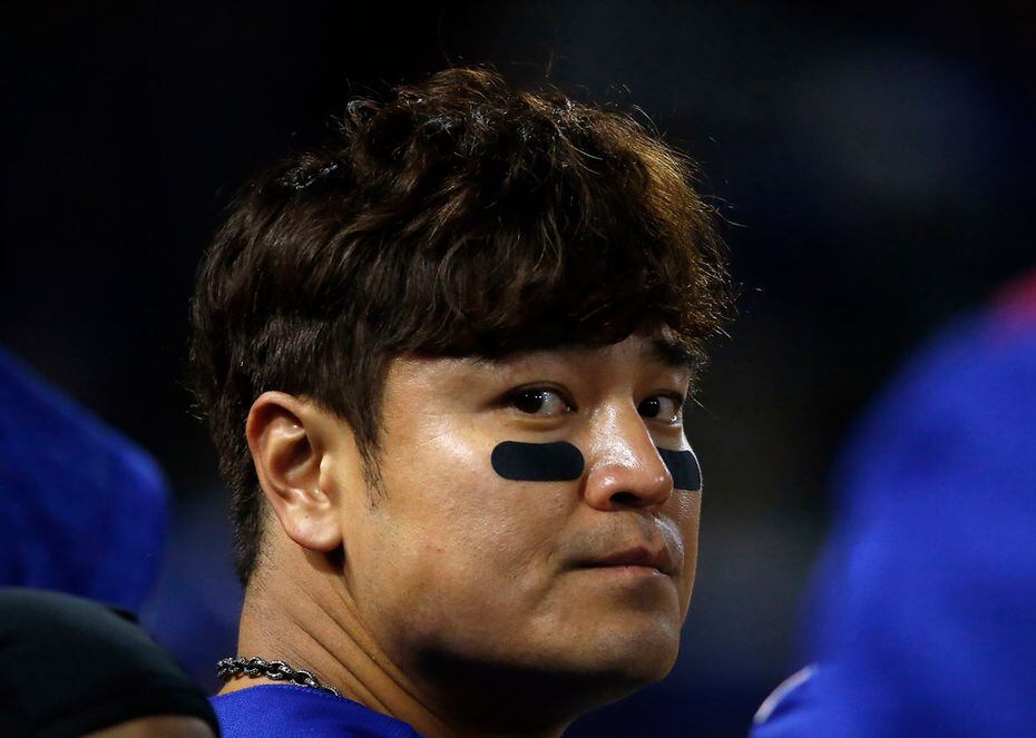 FILE - Shin-Soo Choo sits in the dugout during the seventh inning of a game against Toronto...