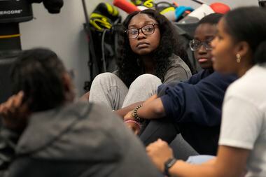 Hillary Amofa listens to others member of the Lincoln Park High School step team after...