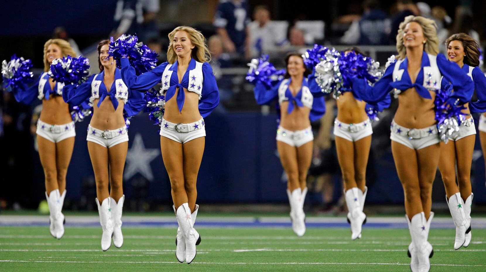 The Dallas Cowboys cheerleaders fly high during their pregame show before the start of the...
