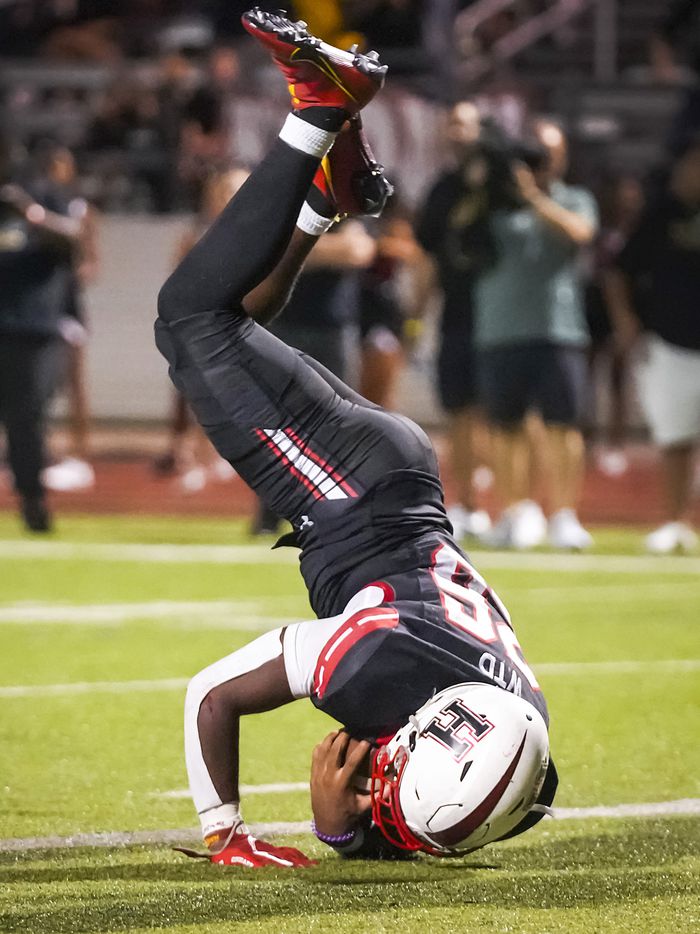 Rockwall-Heath running back  Zach Evans (26) tumbles into the end zone to score the...