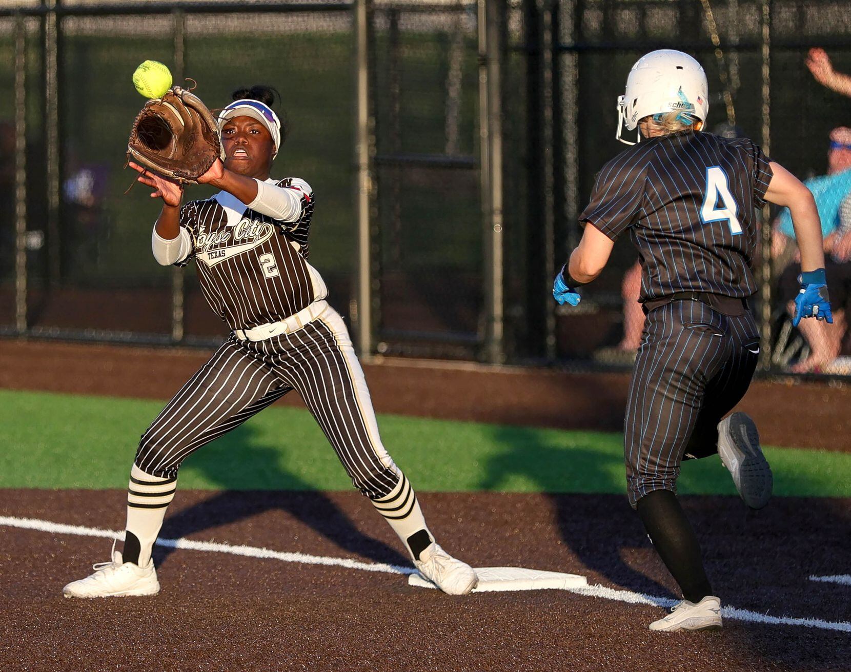 Royce City second baseman Lacey Hicks (2) gets the out at first base against Prosper Rock...