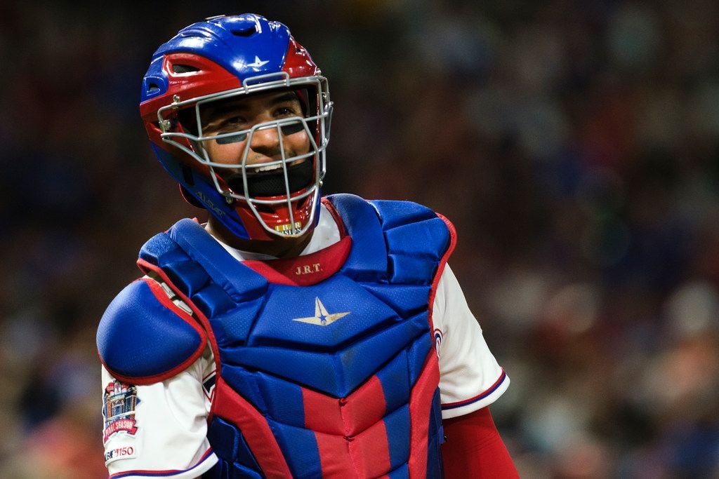 Texas Rangers catcher Jose Trevino looks back to the dugout during the sixth inning against...