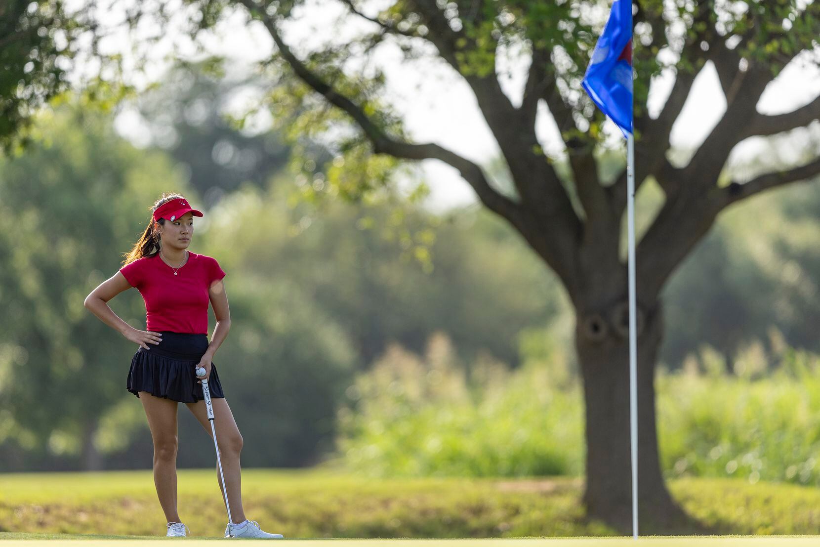 Colleyville Heritage Cindey Xiao waits to putt on the 3rd green during the 5A girls state...