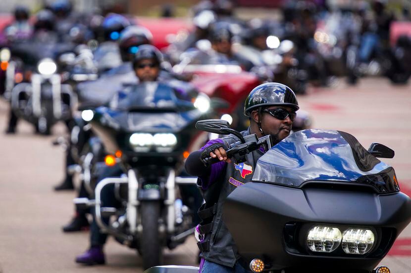 A group of over 400 bikers arrives at Dallas City Hall during a ride and rally commemorating...