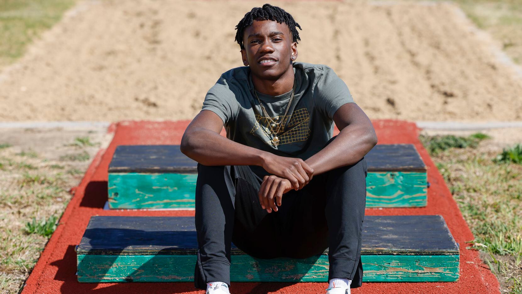 Lake Ridge long jumper Miles Jones poses for a portrait on Wednesday, March 23, 2022 at Lake...