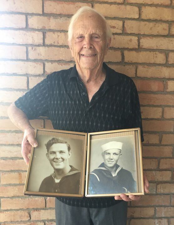 Jack Stowe, 95, poses with photos taken during his time in the Navy during World War II. On the left is Stowe at 18. On the right, he's shown at 15, when he enlisted.
