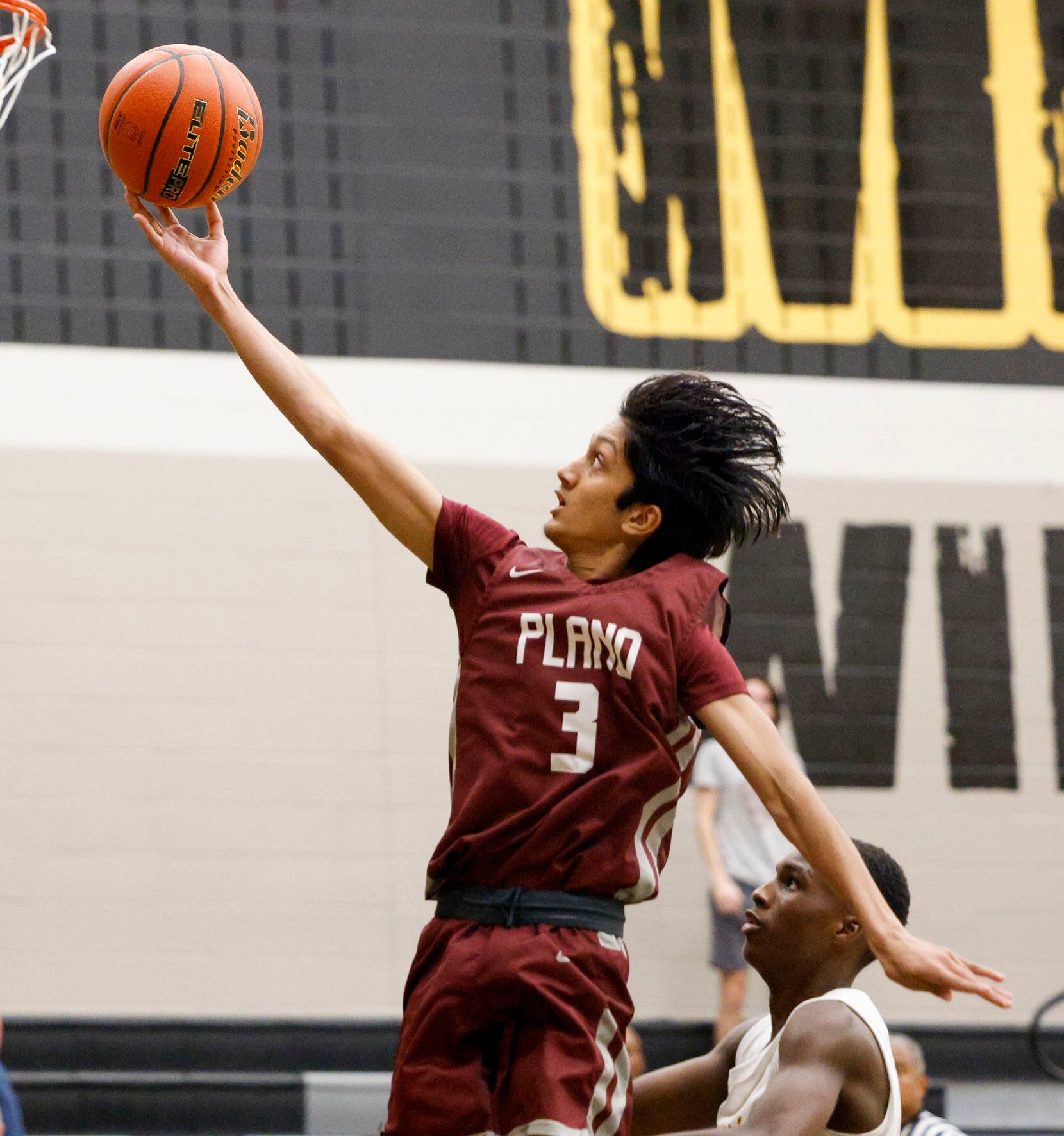 Plano guard Atreya Vaidya (3) attempts a layup during the second half of a non-district game...