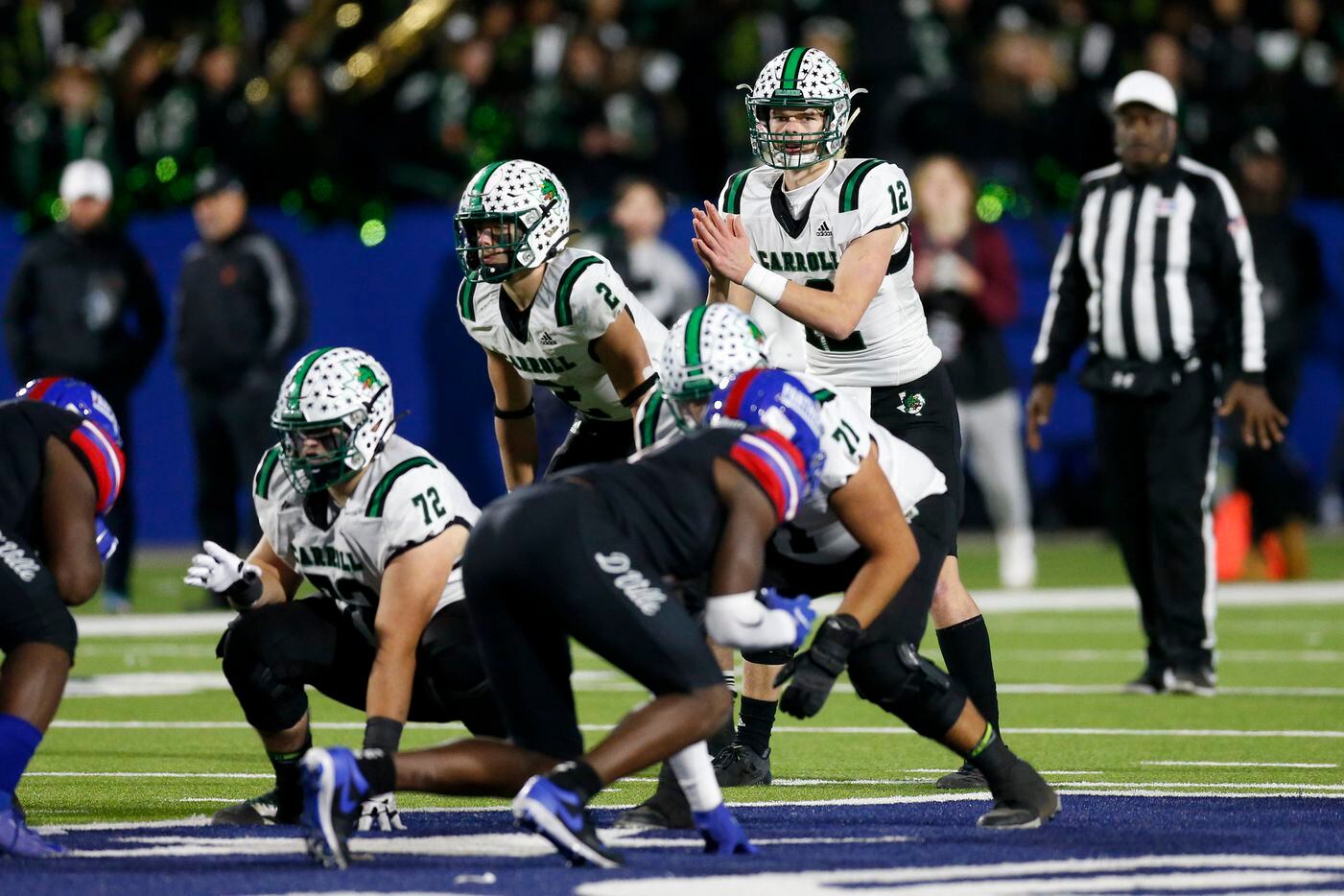 Southlake Carroll quarterback Kaden Anderson (12) readies to take the snap during the second half of their Class 6A Division I state semifinal playoff game against Duncanville at McKinney ISD Stadium in McKinney, Texas, Saturday, Dec. 11, 2021. Duncanville defeated Southlake Carroll 35-9. (Elias Valverde II/The Dallas Morning News)