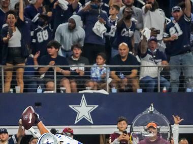 Dallas Cowboys offensive tackle Terence Steele (78) spikes the ball after scoring on a...