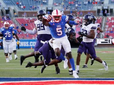 Southern Methodist Mustangs wide receiver Danny Gray (5) scores a touchdown as Stephen F. Austin Lumberjacks defensive back Kris McCune (14) fails to stop him during the first half of their home opener at Ford Stadium in Dallas, on Saturday, September 26, 2020.