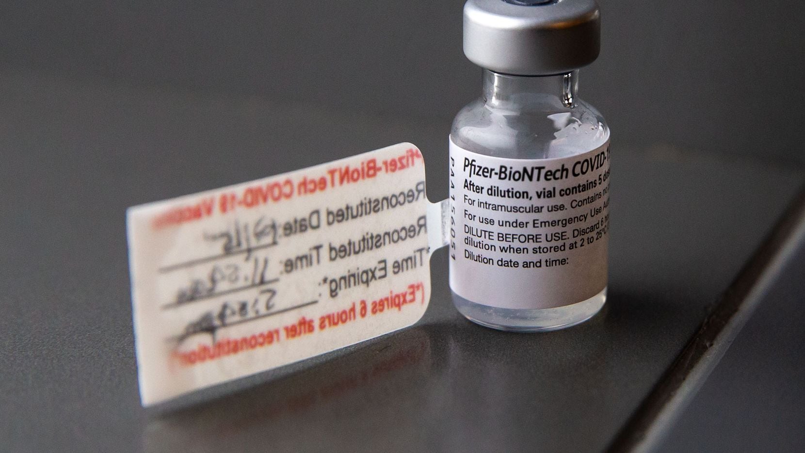 A vial containing five doses of the Pfizer COVID-19 vaccination during a media event at...