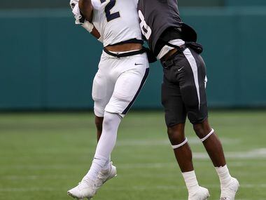 Keller wide receiver Tre' Griffiths (2) tries to come up with a reception against Lewisville...