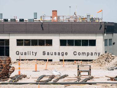 The Quality Sausage Company’s location at 1925 Lone Street Drive in Dallas, Texas, partially obstructed by an ongoing construction project.
