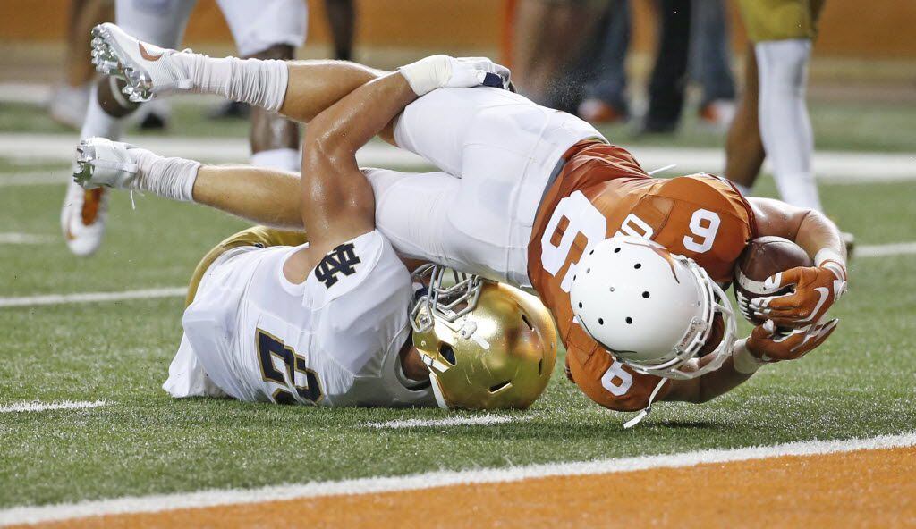 Texas receiver Jake Oliver (6) stretches for the goal line after a second-quarter pass...