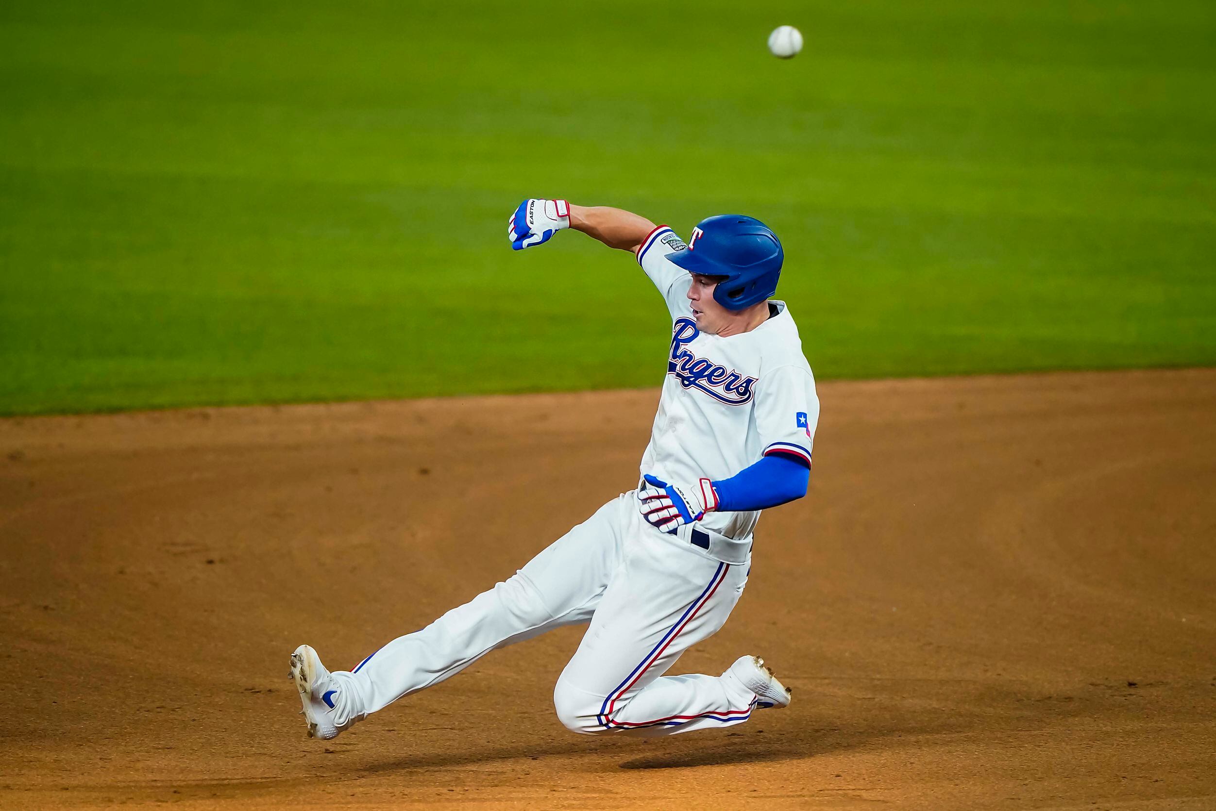 Outfielder Scott Heineman beats the throw to second for a stolen base during Texas Rangers...