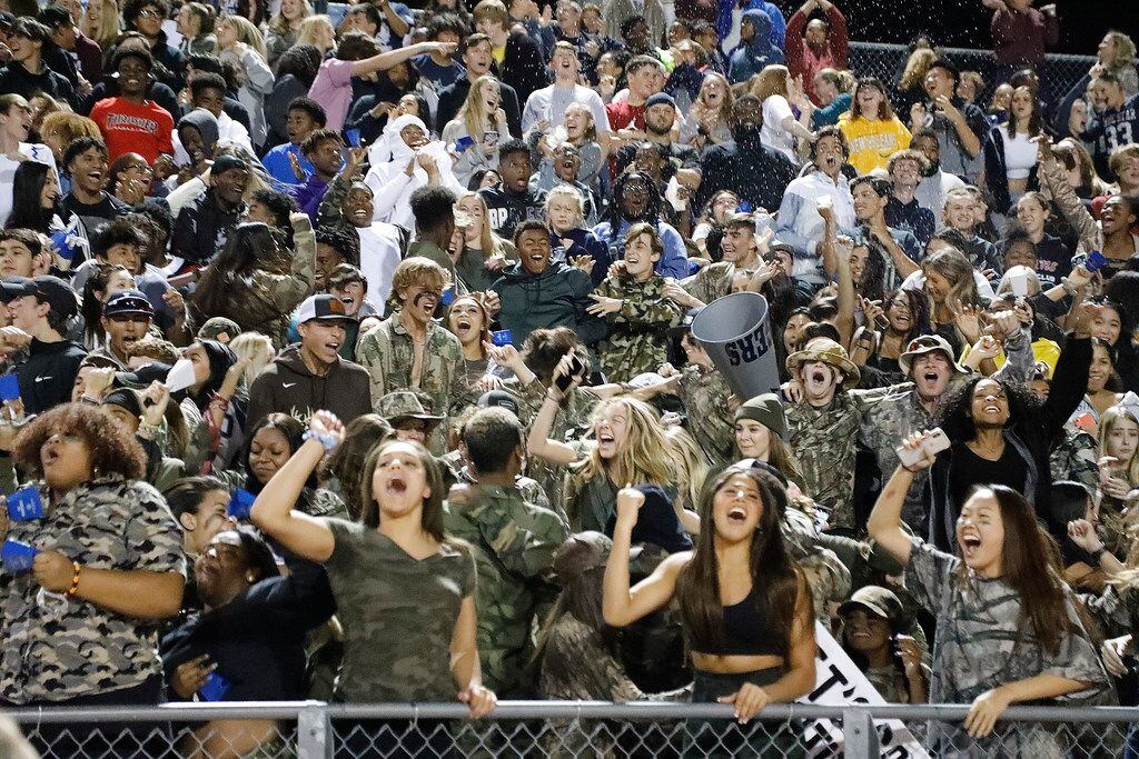The Lone Star High School student section celebrates the go ahead touchdown during the...