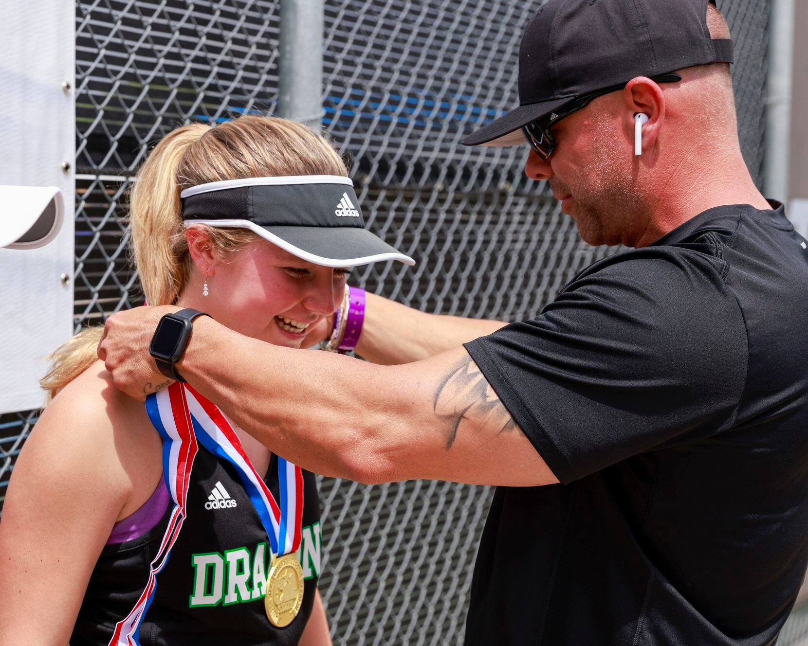 Southlake Carroll’s Brennan Becicka receives her 6A girls doubles championship medal from...