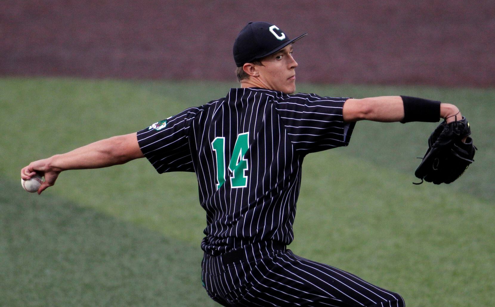 Southlake Carroll pitcher Griffin Herring (14) delivers a pitch to a Keller batter during...