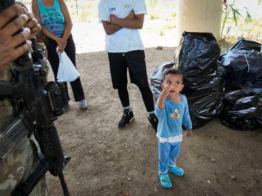 Enrique, 3, a migrant from Colombia, who arrived with a group of migrants who turned...