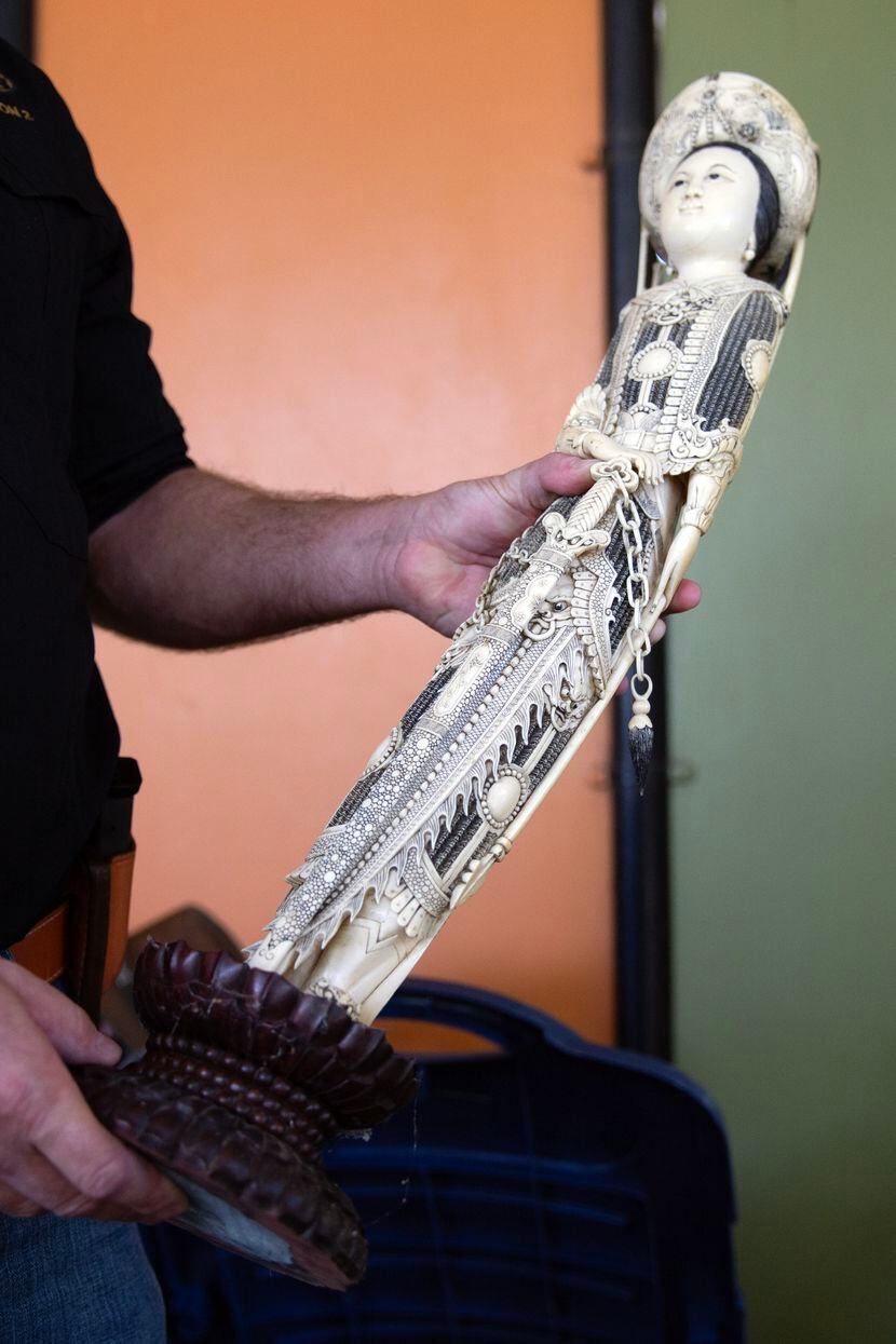 An inherited piece of ivory is surrendered at the Dallas Zoo in Dallas, for the Toss the...