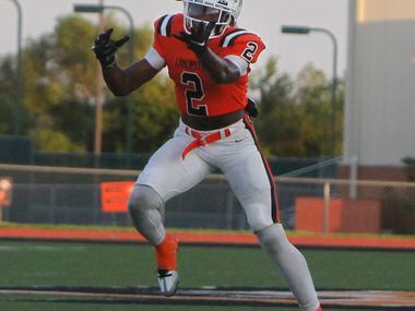 Lancaster Kewan Lacy (2) pulls in a pass in the Tigers backfield during first half action...