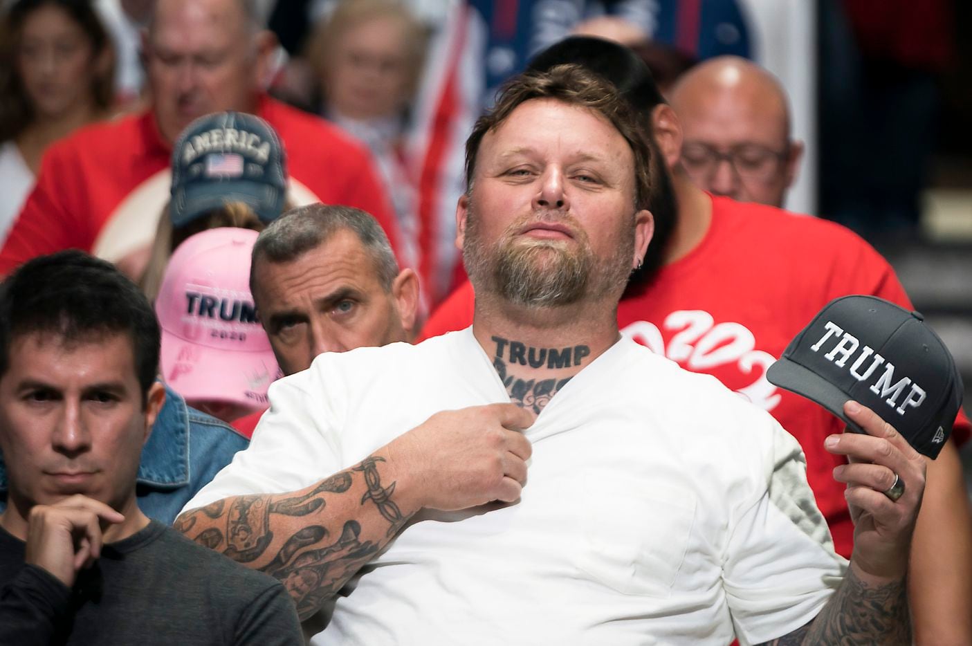 A supporter shows off hit Trump tattoo before President Donald Trump arrived for a campaign...