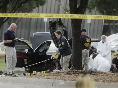 The FBI and Garland Police investigate the scene of a shooting on May 4, 2015, at the Curtis...