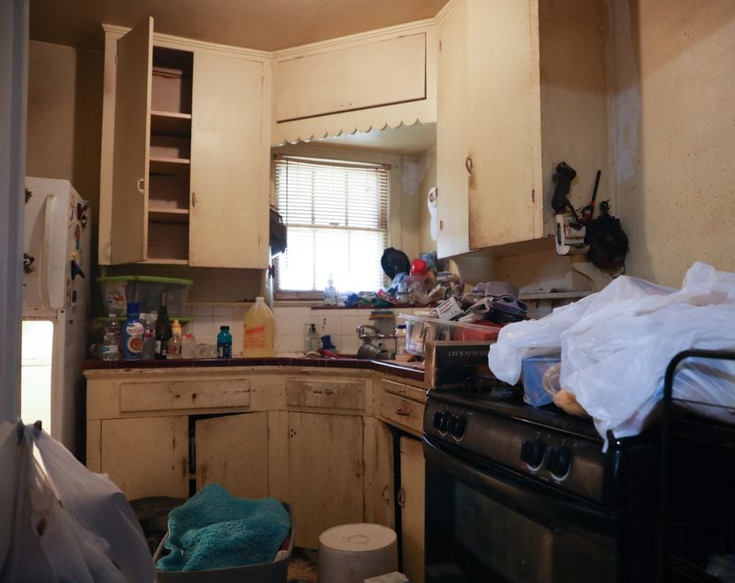 Volunteers and family help Robernetta Jones empty her house on June 28, 2022, before repairs...