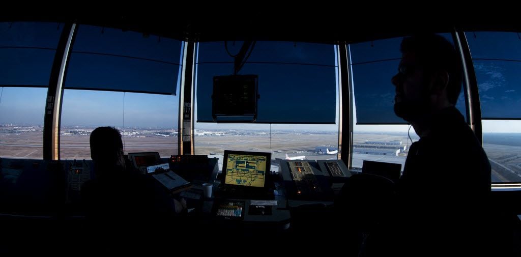 Air traffic controllers work at the DFW Airport from the West air traffic control tower in Irving December 27, 2013. (Nathan Hunsinger/The Dallas Morning News) DFW40th