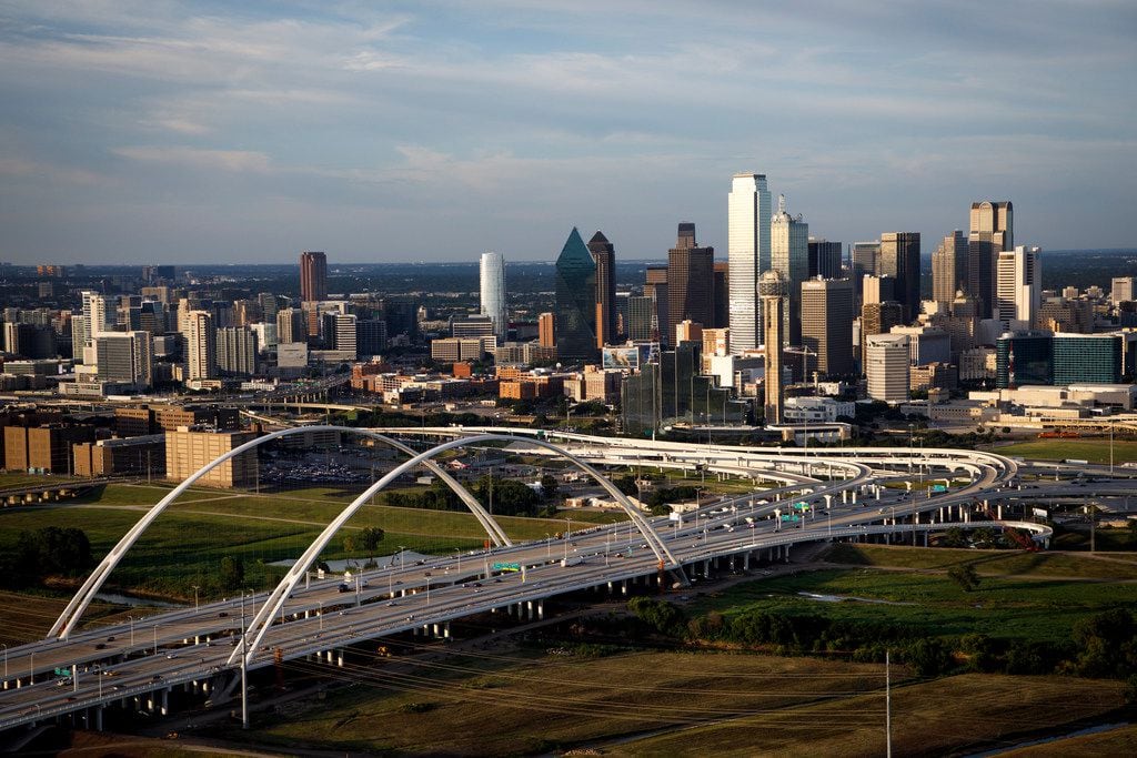 Downtown Dallas and the Margaret McDermott Bridge are shown on July 27, 2017.