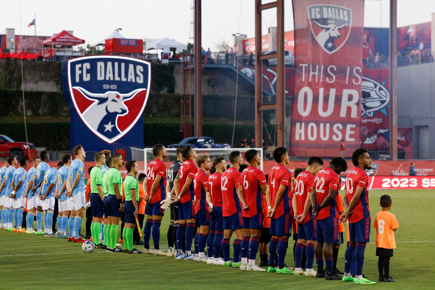 FC Dallas and the Philadelphia Union stand for the national anthem before a match at Toyota...