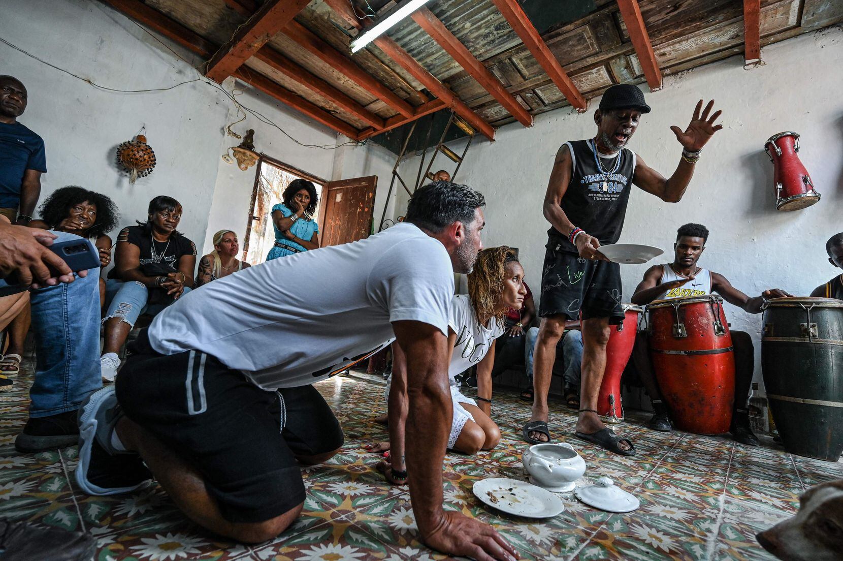 Cuban devotees of Santeria gather for a ritual on September 13, 2022 in a Havana house. The...